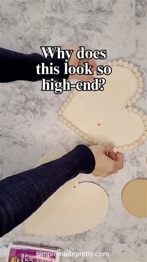 Why does this look so high-end… but cost almost nothing?! 😍💝 I still can’t believe this Valentine’s DIY cake stand came from Dollar Tree finds. A little paint, a little glue, and suddenly it looks like something from a boutique 🥹✨ Perfect for desserts, treats, gifts, or even tiered tray styling 💕 Use food safe paint or cover w parchment paper. Would you try this? 👀👇 Save this for later link in bio to watch the full tutorial ✂️ 💗https://simplemadepretty.com/dollar-tree-diy-cake-stand/ #dol