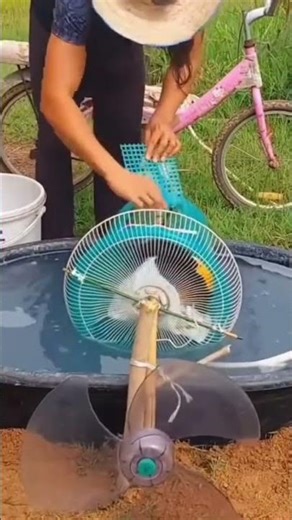 someone's creative idea to make a simple clothes washing machine using a used fan
