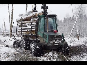 Logging in winter forest withTimberjack 810B