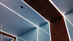 Modern interior design, decorative led lighting on the ceiling. High quality 4k footage