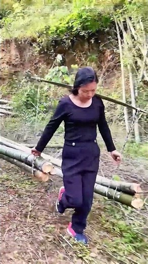 A Woman's Labor: Transporting Bamboo with Ropes and Shoulders