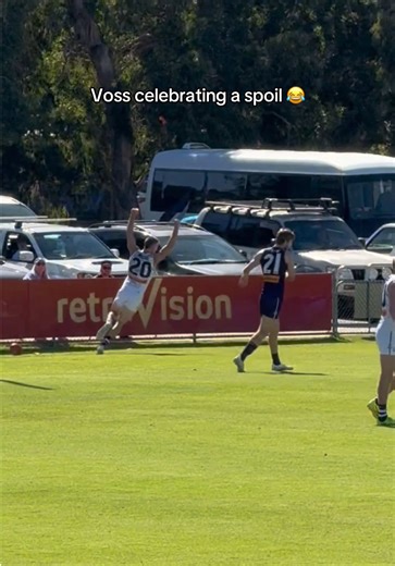 Voss Celebrates a Great Spoil in AFL Footy