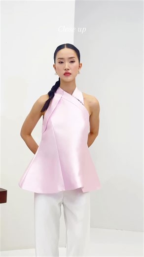 NOMI on Instagram: "Here’s a 360 of pure sophistication. Consider this your sign that you don’t have to choose a good side. Zhen top has them all covered 😍✨"