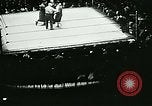 November 20, 1930 – New York City USA: People gather to watch a boxing bout held at Madison Square Garden in New York City