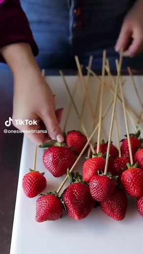 Fresh strawberries with a hard candy shell around them. Crunchy on the outside and juicy on the inside. https://onesweetmama.com/hard-candied-strawberries/ #strawberry #hardcandy #candymaking #valentinesdaytreats #bakebakebake #sweets
