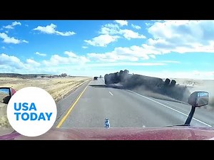 Dramatic video: Semi-truck overturns on interstate | USA TODAY