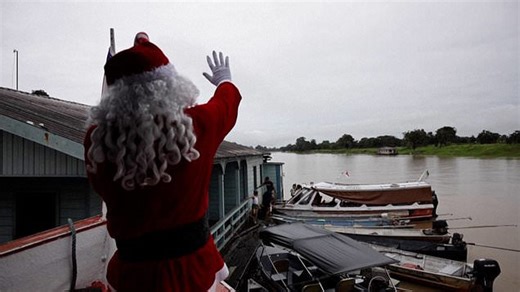 Santa delivers gifts by boat to remote Amazon children