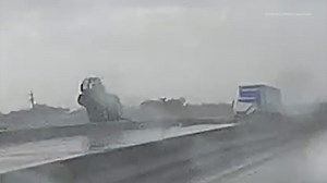 Video: Driver escapes moving big rig as it goes off overpass on Highway 225