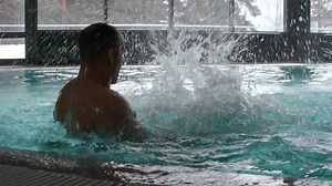 Woman and Man Having Fun in Swimming Pool