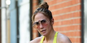 JLo works out in bright yellow gym wear and snake print leggings