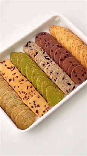 Multi Flavored Cookies 🥰 dough preparation take a bowl softened butter 300g powdered sugar 100g salt 4g mix well light cream 55g room temperature mix well sift cake flour 440g almond flour 60g mix well knead the dough separate the dough into 6 pieces (1)cranberry cookies 20g cranberry mix well (2)matcha almond cookies matcha 2g almond slices15g mix well (3)cheese cookies shredded mozzarella cheese 30g mix well (4)earl grey tea cookies earl grey tea 2g mix well (5)cocoa cookies cocoa powder 5g h