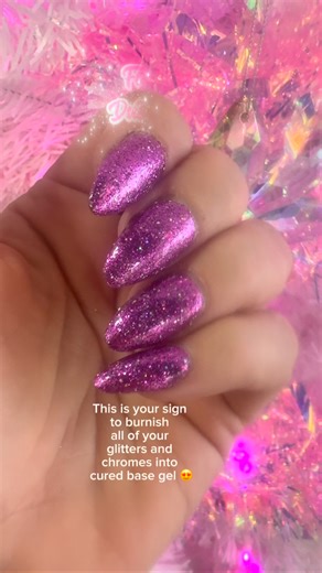 It’s so fast, it’s so easy, and the payoff is absolutely stunning! Apply base gel, cure 30 seconds and then burnish your glitters or chromes by taking a brush, dipping it into the glitter and then rubbing in circular motions into the cured base gel, dust off the extra, cure 60s and then repeat. Then use a gel top coat and cure for 60 seconds. Trust me - you’ll be so amazed and it’s so fun! #burnishgel #fairydust #sparkleandco #diynails #holonails ￼￼ | Sparkle & Co. Luxe Nails