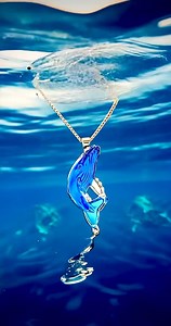 SPLASH! Stir up an ocean of on-lookers with the casted glass Whale pendant set in 14K Gold by designer Matt. https://bit.ly/3wAT99o | Martin & MacArthur