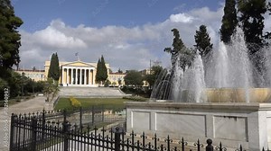 fountain in the background of Zappeion - a building in classical style in Athens
