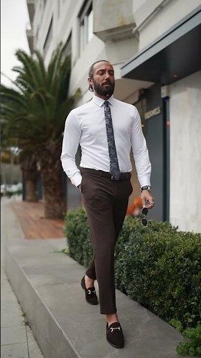 Slim-fit brown pants, crisp white formal shirt, and polished brown loafers the ultimate smart casual