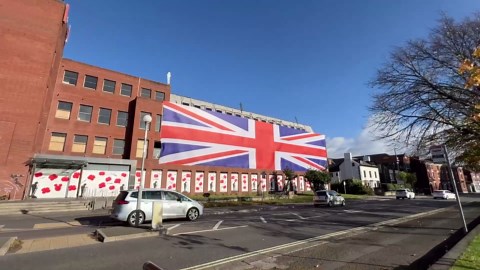 Property developer drapes huge Union Jack flag on old council HQ after planning row
