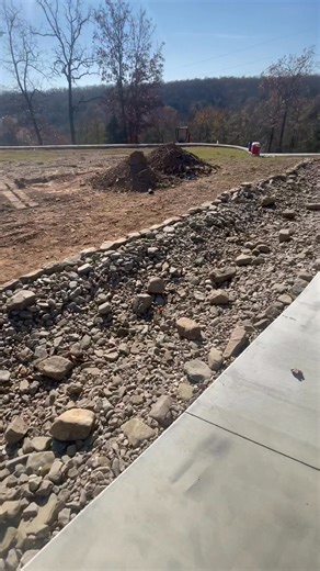 Just about finished with this huge dry creek bed. | Express Tree & Landscaping Services LLC.