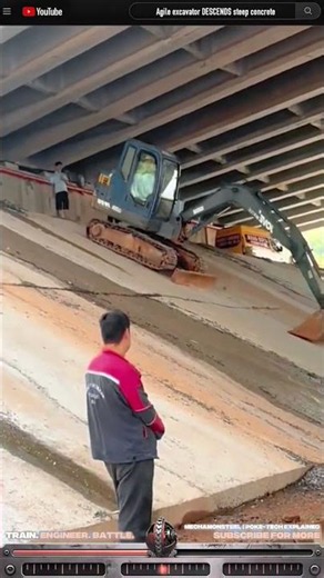 Agile excavator DESCENDS steep concrete