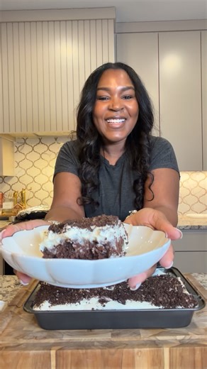 Chocolate Oreo Poke Cake Chocolate box cake mix - 3 eggs, 1/3 cup oil, 1 cup water 2 cups of milk Instant cookies and cream pudding Instant vanilla pudding Cool Whip Crushed Oreo Cookies Mix and Bake cake according to packaging. Cool. Poke holes into cake. Slightly Mix cookies and cream pudding with 1 cup of milk. Should be a watery consistency. Immediately pour over the cake and spread evenly into the holes. Mix vanilla pudding with one cup of milk. Whip until you have a pudding consistency. Fo