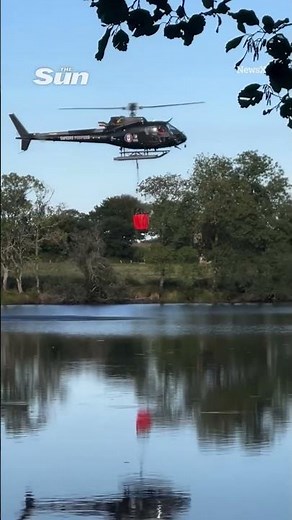 Shocking moment helicopter spins out of control and crashes into lake