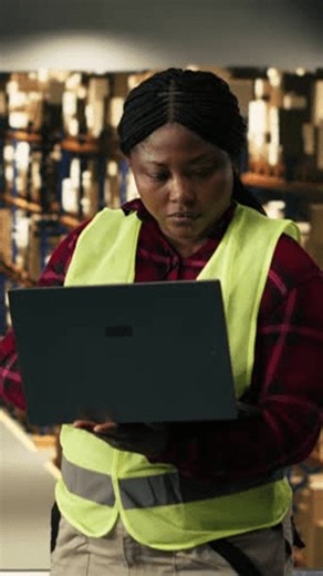 clip-4032464677-vertical-video-african-american-worker-using-laptop