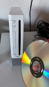 HELP - grinding/clicking noise, wii will not accept disc and makes scary noises.