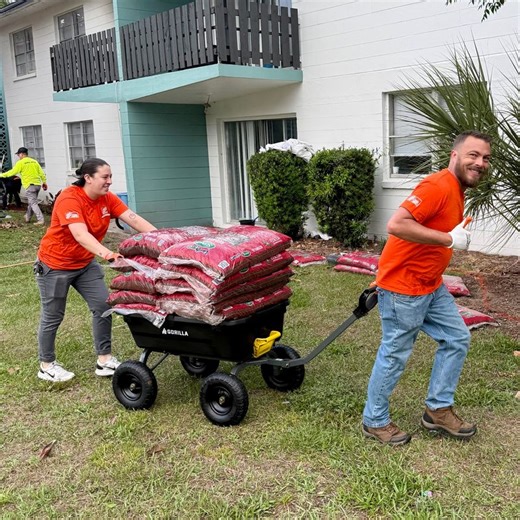 Home Depot volunteers spruce up outdoor space at veterans housing