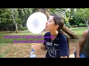 Girl blows huge bubblegum bubble and it pops all over her face
