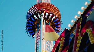 Freefall Tower in Theme Park with German Flag in Foreground