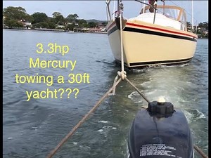 Tiny outboard big boat 3.3hp Mercury towing yacht