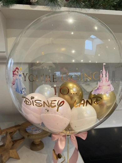YOU’RE GOING TO DISNEYLAND ⭐️ • Princess disney land bubble balloon with our luxury gold travel ticket ✨ • #disneyland #princess #christmassurprise #castle #bubbleballoons #balloonartist #balloondesign #ballooninspo #travel #goldenticket #paris #santasurprise