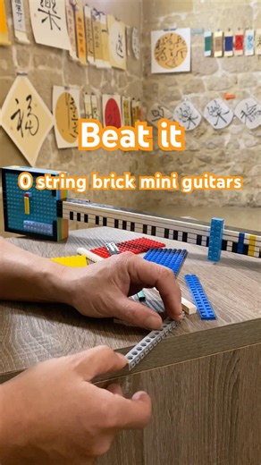Two zero-string brick mini guitars perform “Beat It”