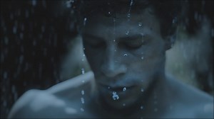 Standing man under a cold rain - Free Stock Video