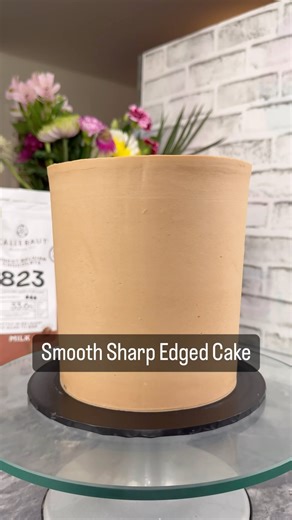 How I create my smooth sharp edged cake using @colour.mill cake scraper and @thesugarpaste flexi scraper and the delicious @callebautchocolate all available from @the_cake_decorating_co #smoothcake #buttercreamcake #ad | Jinny's Cakes Bakes & Decorates