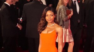 Naomie Harris all glamour in orange at the Spectre premiere