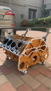 A gold BMW V8 transformed into a table. A bold look, a unique design, and true character. #enginetable #bmw #handmade | Metal Works Studio