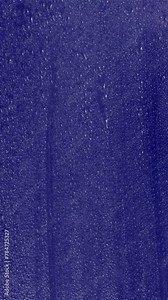 a window weather water wet transparent drops surface glass rain rainfall storm stormy falling condensation windshield drip backdrop light clear 4k motion raindrop night background Stock Video