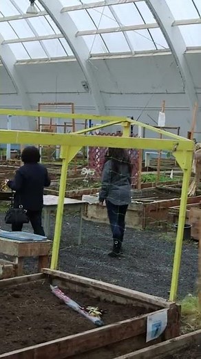 Lucy shows off the community greenhouse in Inuvik (Vertical)