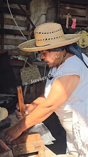 A wooden tortilla-making machine
