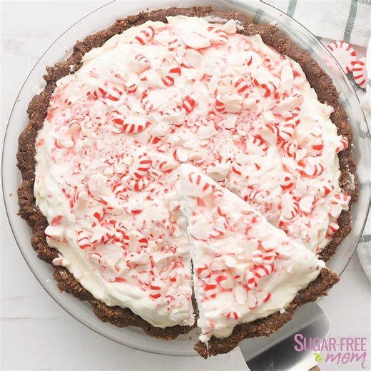 SAVE this recipe for the Holidays! This incredibly Easy Sugar-Free Low Carb Keto Peppermint Cheesecake Pie is a no bake sensation and will be your favorite low carb dessert to make for the holidays with family and friends! This is also Nut Free! | SugarFreeMom.com
