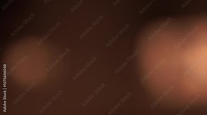 vidéo de transition, apparition de lumières douce orangé sous forme de bulles qui se rencontrent , puis fondu au noir