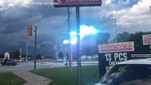 Electricity surges across the downed power line in London’s south end caught on camera