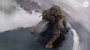 U.S. Coast Guard jumps onto moving suspected drug-smuggling submarine