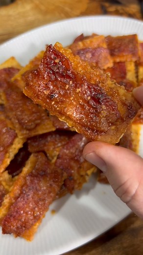 Club crackers x 2 sleeves 1 lb bacon(not thick cut) Brown sugar BBQ rub Red pepper flakes Line a baking sheet with parchment paper and a baking rack. Fit as many club crackers on it as possible. Cut your pound of bacon into 4 sections. Place one slice of bacon on each cracker. Sprinkle with brown sugar, your favorite bbq seasoning, and red pepper flakes. Bake at 350° for 25-30 minutes until bacon is cooked through. Let cool down and enjoy… #bacon #appetizers #appetizer #easyrecipes #easy #finger