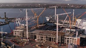 Slow aerial orbit showing construction progress at Everton stadium on the river Mersey