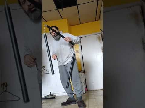 Martial arts. Three section staff for beginners.