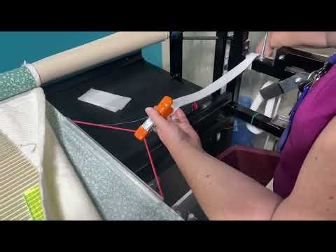 Red snapper, ready edge clamps with Nolting longarm quilting machine. ￼