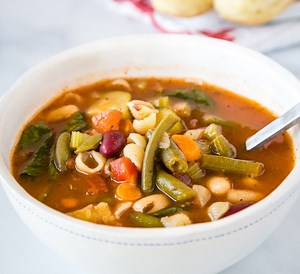 Minestrone Soup - Make the classic minestrone soup at home!  This soup is made all in one pan, is full of all sorts of veggies and even pasta, all in a delicious rich tomato based broth.