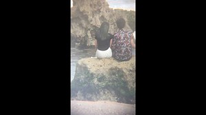 Couple's beach selfie goes wrong when wave washes them off rock