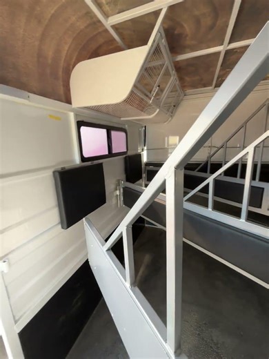 This is a 2-horse load trailer, small slant-load horse trailer.
